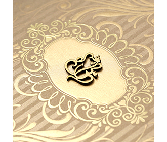 Hindu floral wedding invitation card in shades of golden